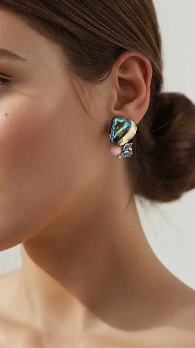 Sculptural abalone and coral earring, worn