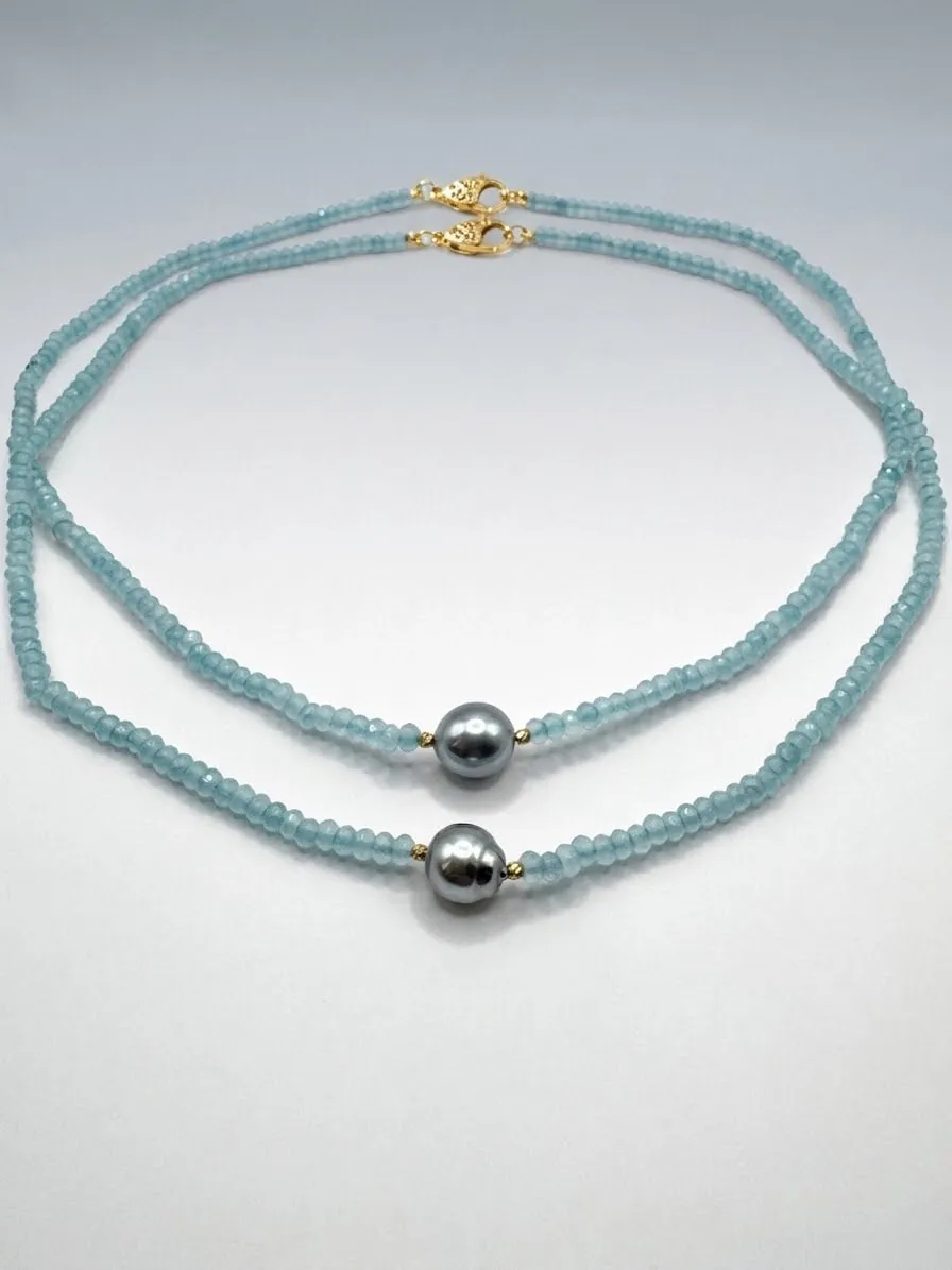 Aquamarine bead necklace with two dark pearls