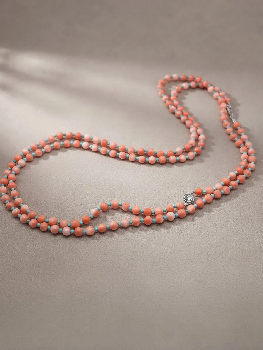 Long coral bead necklace with diamond accents
