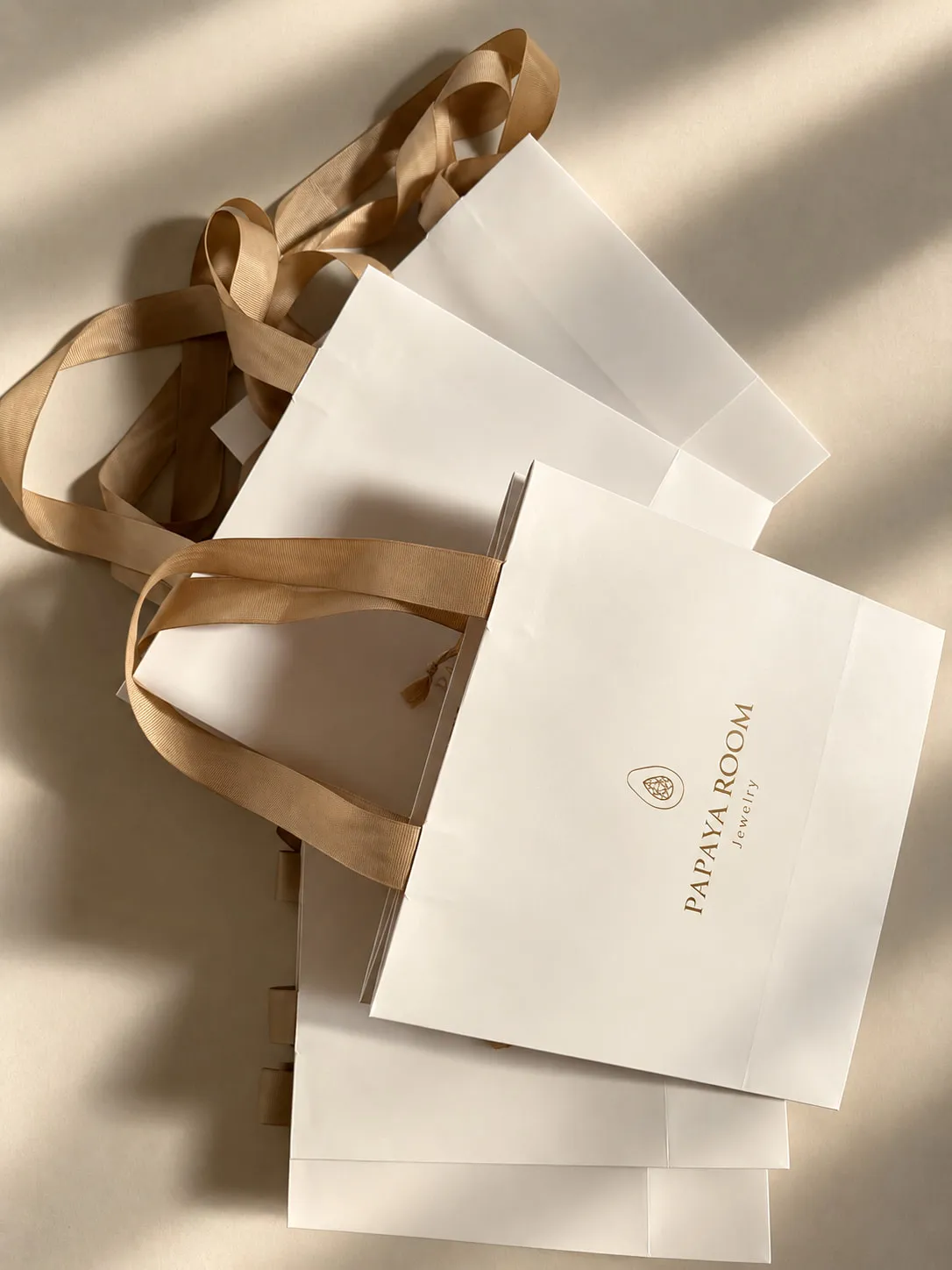 Papaya Room gift bags with kraft ribbon handles