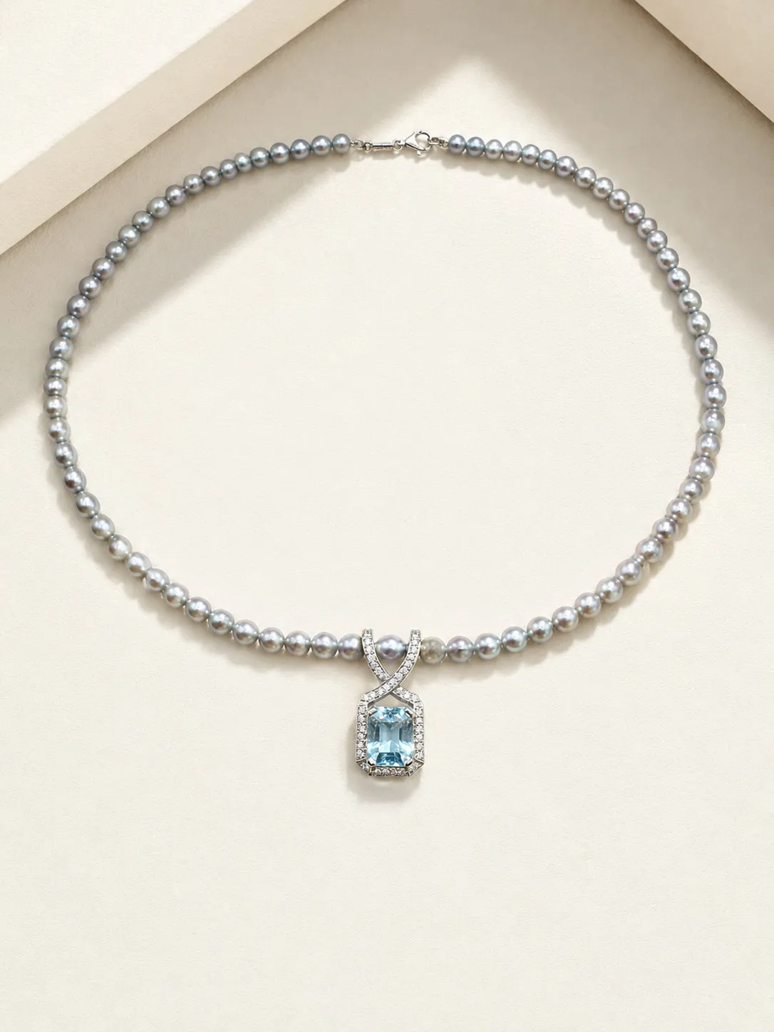 Grey pearl necklace with an aquamarine and diamond pendant