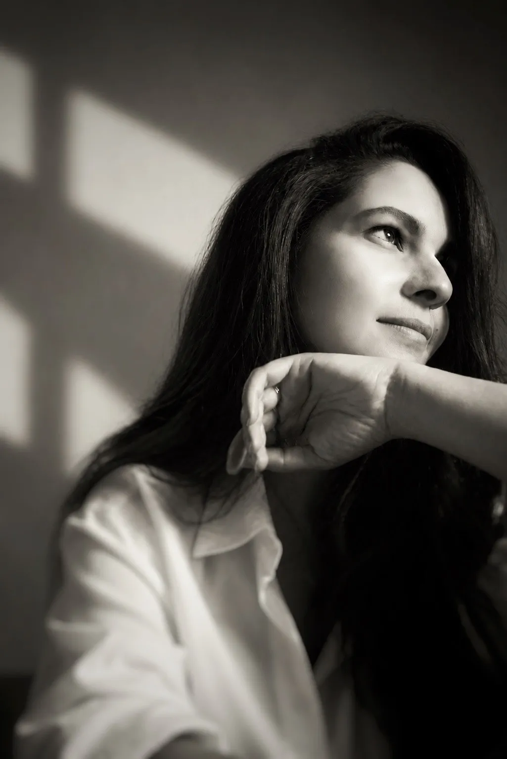 May AlFassam, Founder and Creative Director, in a black and white portrait
