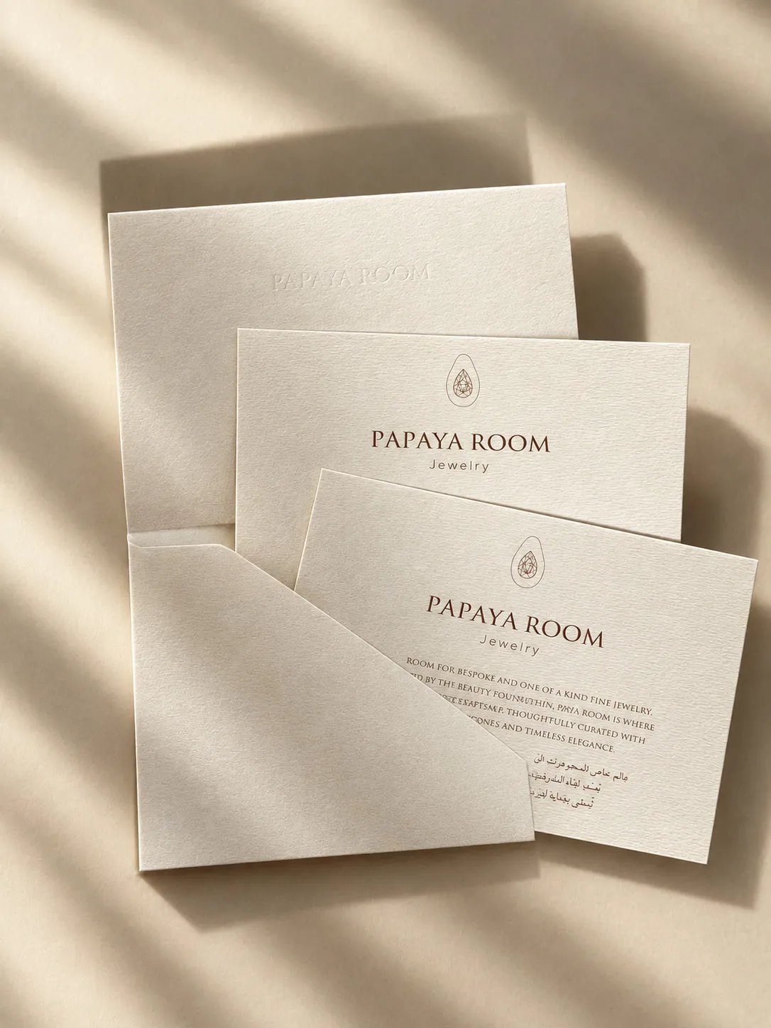 Papaya Room cards and folder in afternoon sunlight
