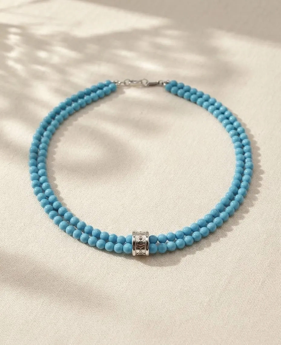 Double-strand turquoise bead necklace with a gold and diamond clasp