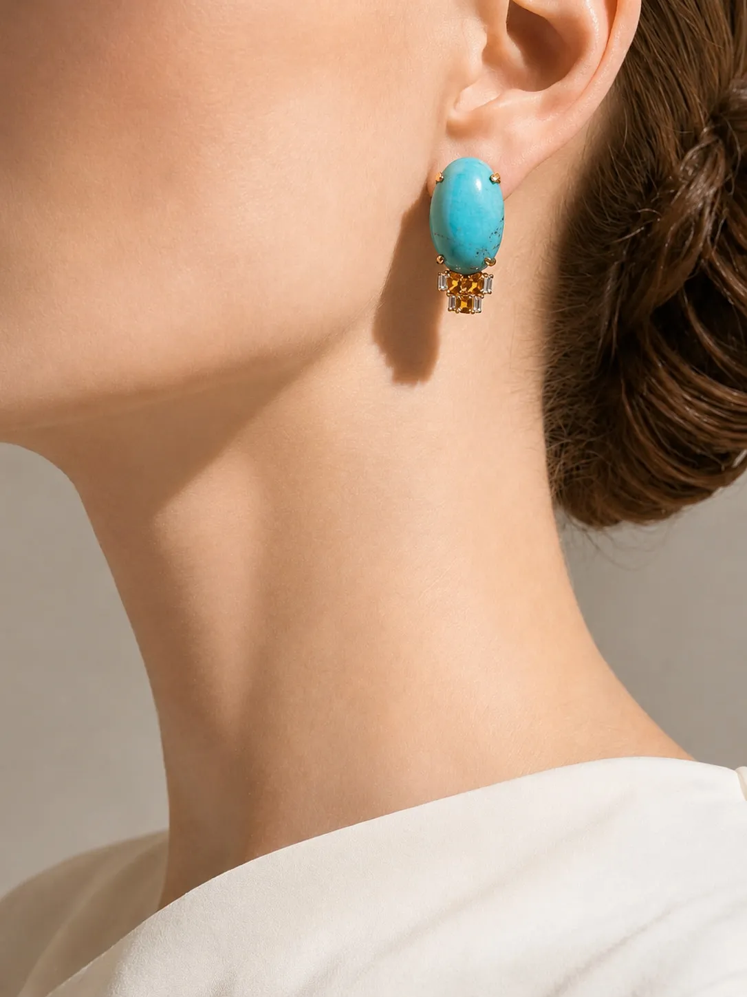 Turquoise earring worn, seen in profile